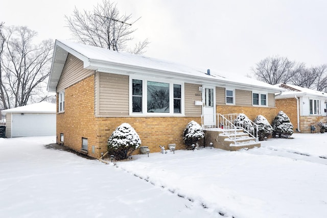 view of front of home with an outbuilding and a garage