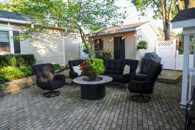 view of patio / terrace with an outbuilding and an outdoor hangout area