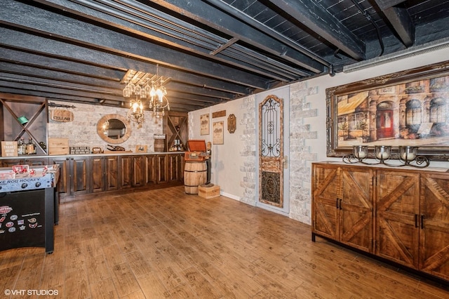 interior space with an inviting chandelier and wood-type flooring