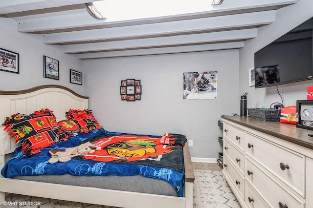 bedroom featuring beam ceiling