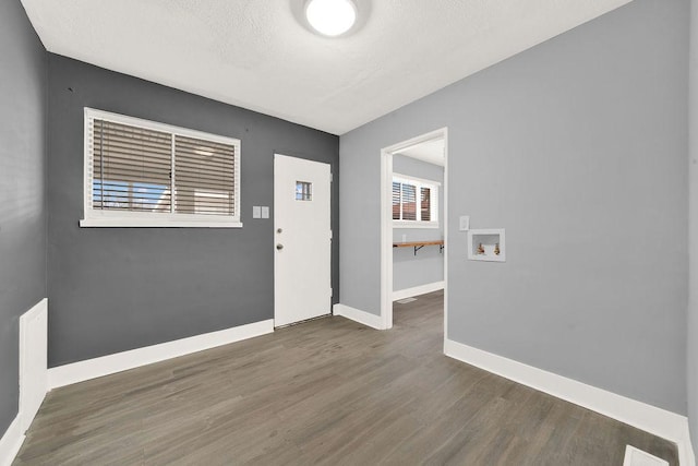 entryway with dark hardwood / wood-style flooring