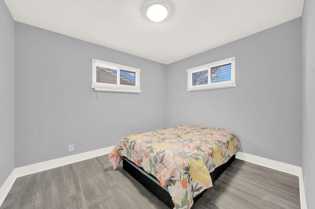 bedroom featuring dark wood-type flooring