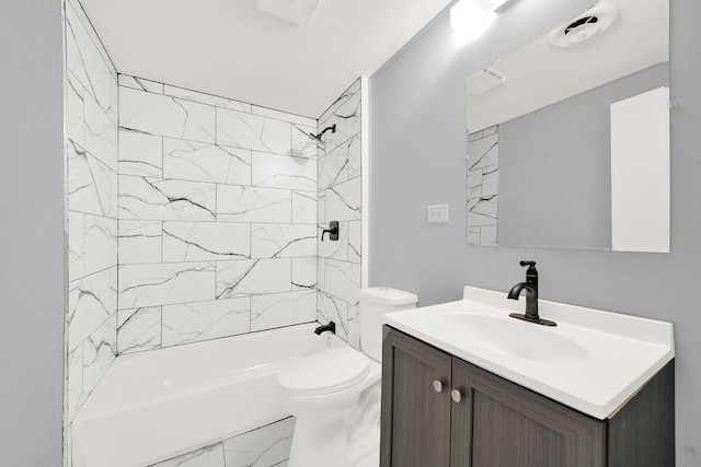 full bathroom featuring vanity, toilet, and tiled shower / bath combo