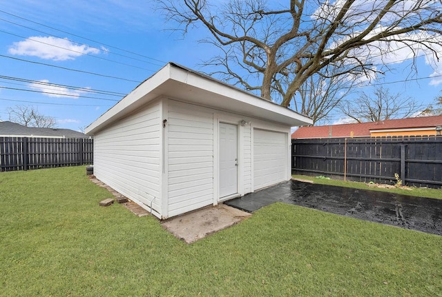 view of outdoor structure featuring a lawn