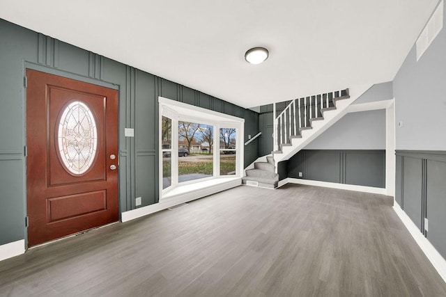 foyer with hardwood / wood-style flooring and a wealth of natural light