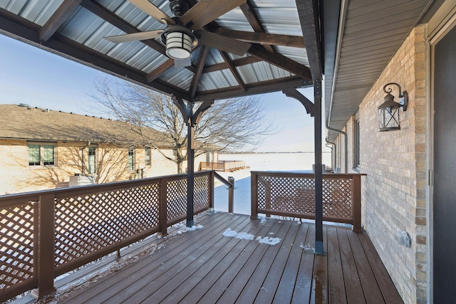 wooden terrace with ceiling fan and a gazebo