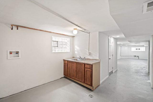 clothes washing area with sink and washer hookup