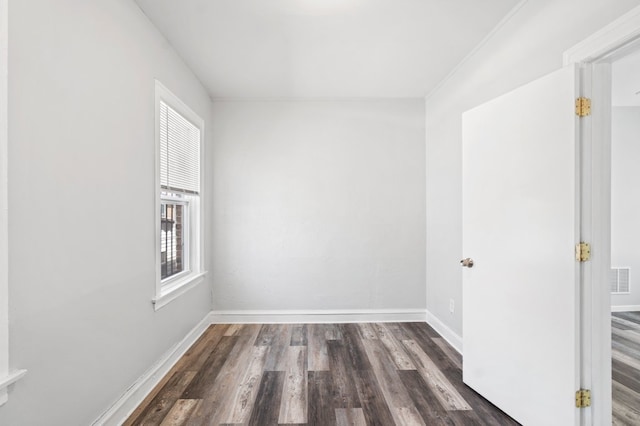 unfurnished room featuring dark wood-type flooring