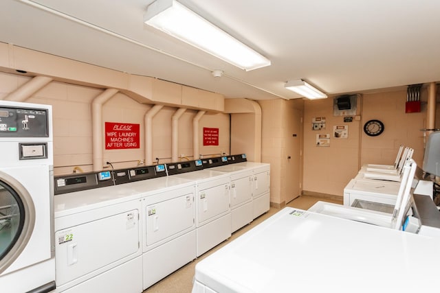 laundry area with washing machine and clothes dryer