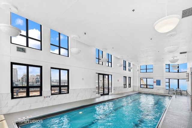 view of pool featuring french doors