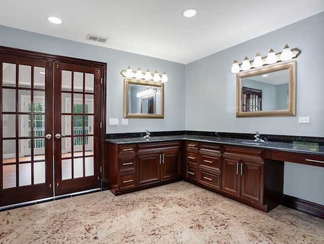 bathroom featuring french doors and vanity