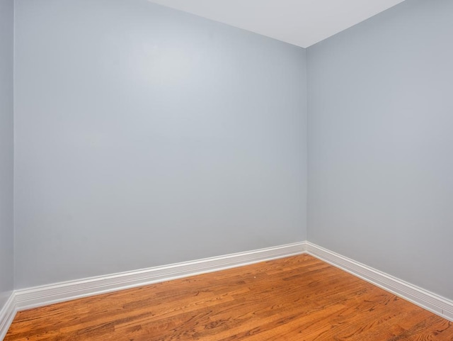 unfurnished room featuring hardwood / wood-style floors