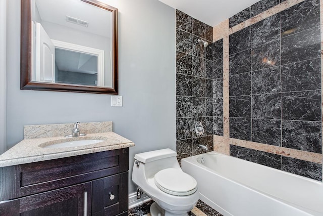 full bathroom featuring vanity, toilet, and tiled shower / bath