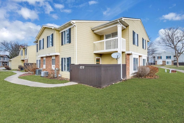 view of home's exterior featuring a yard and cooling unit