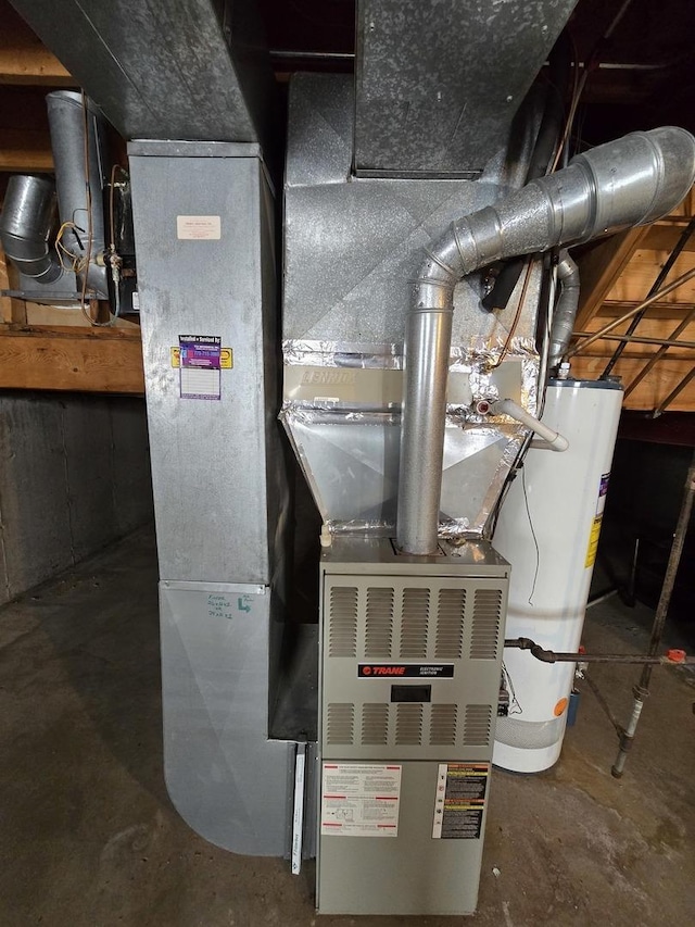 utility room with water heater