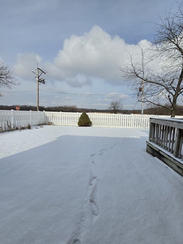 view of yard layered in snow