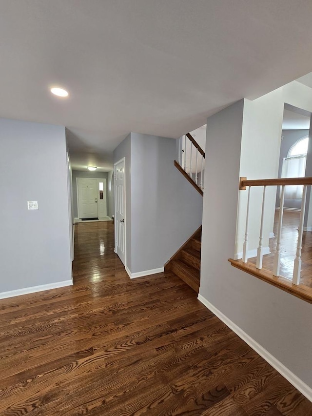 hall with dark wood-type flooring