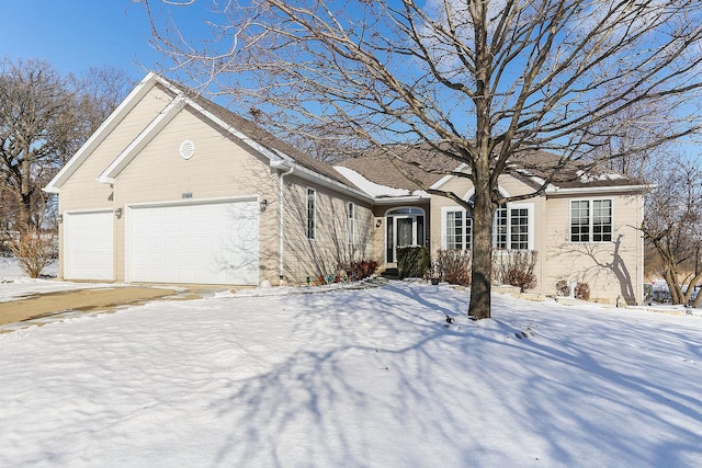 ranch-style house featuring a garage