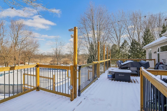 view of snow covered deck