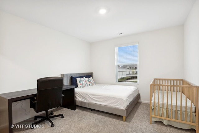 bedroom featuring light colored carpet