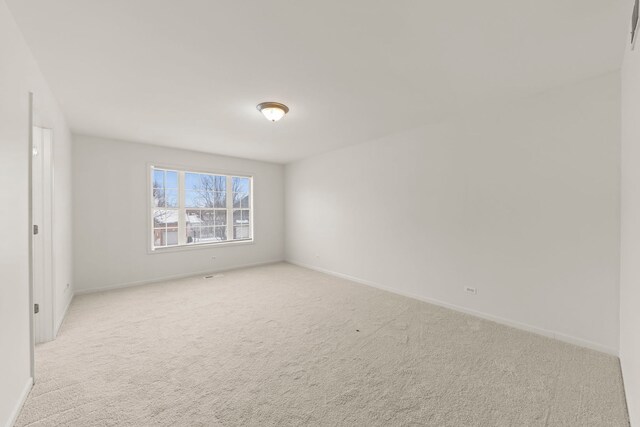 bathroom with toilet, vanity, tile patterned flooring, and a wealth of natural light