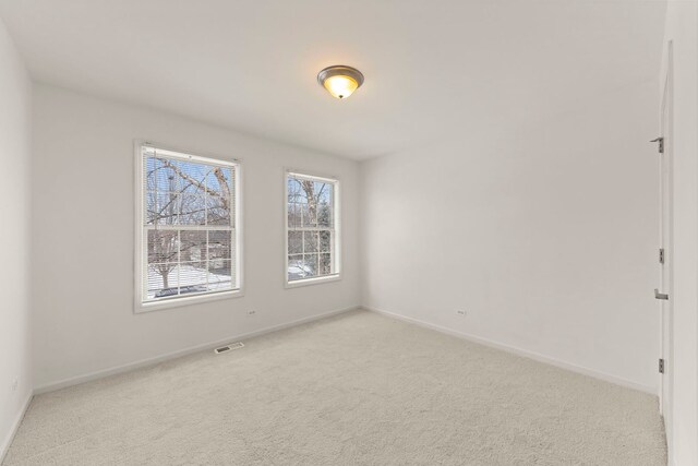 bedroom with light colored carpet