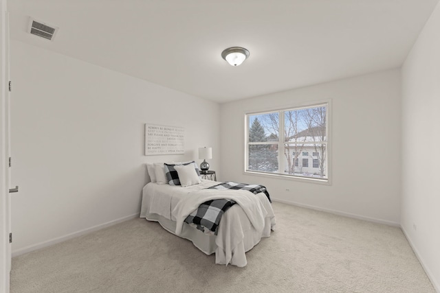 bedroom featuring light colored carpet