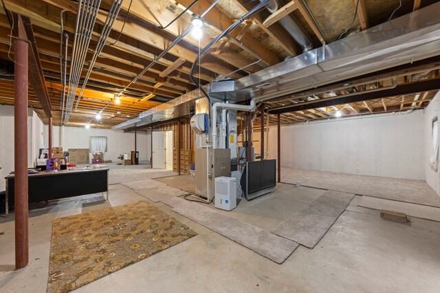 basement featuring pool table and gas water heater