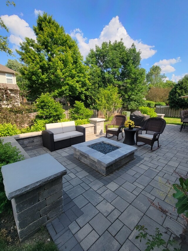 patio terrace at dusk with an outdoor fire pit