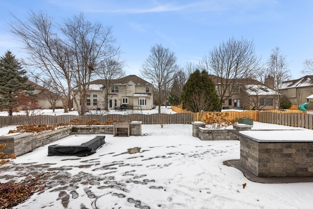 view of snow covered property