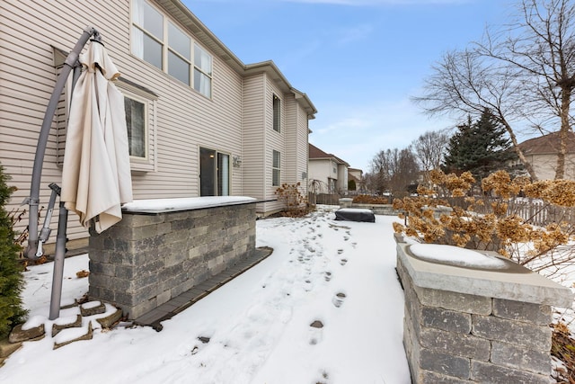 view of yard layered in snow