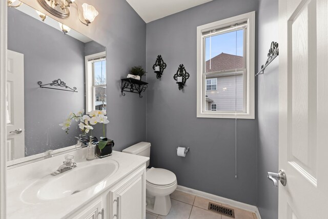 tiled dining space with sink and an inviting chandelier