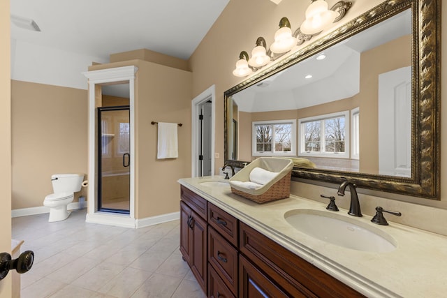 bathroom featuring vanity, toilet, a shower with shower door, and tile patterned flooring