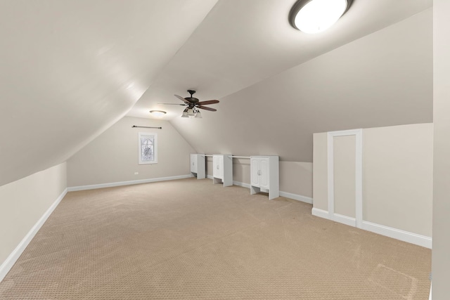 bonus room featuring ceiling fan, lofted ceiling, and light carpet