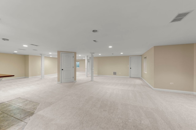 basement featuring light colored carpet