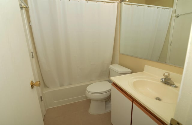 full bathroom with tile patterned flooring, shower / bath combo, toilet, and vanity