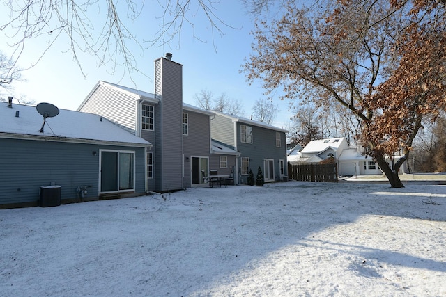 rear view of property with central air condition unit