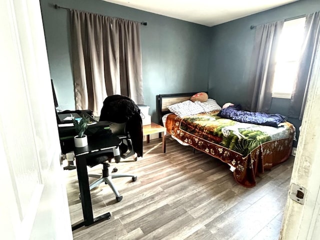 bedroom featuring hardwood / wood-style floors