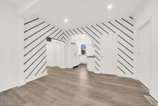 bonus room featuring hardwood / wood-style flooring