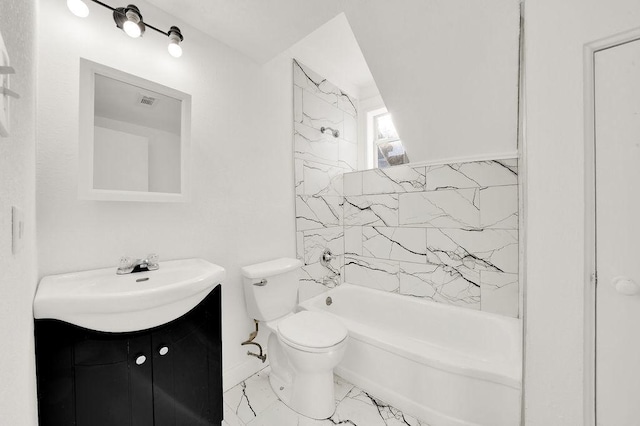 full bathroom with tiled shower / bath, vanity, and toilet