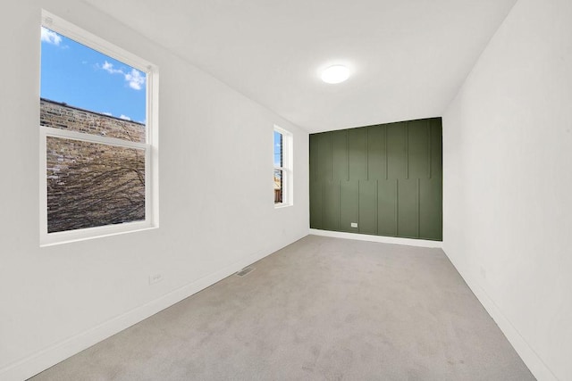 empty room with light colored carpet