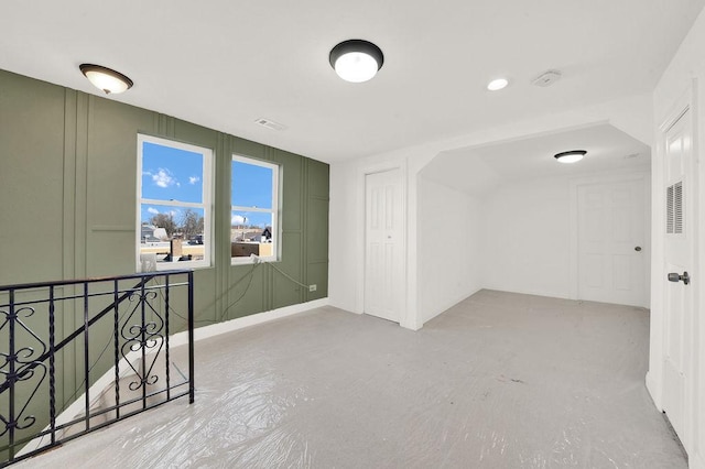 unfurnished room featuring concrete flooring