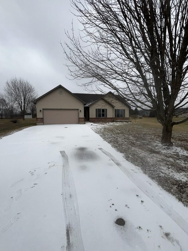 ranch-style house featuring a garage