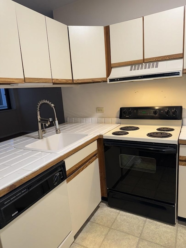 kitchen with exhaust hood, sink, electric stove, dishwasher, and tile counters