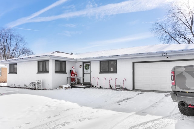 ranch-style home with a garage