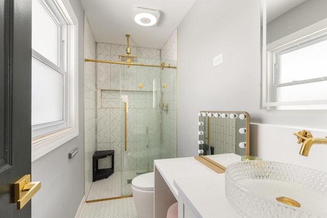 bathroom featuring tile patterned floors, toilet, a shower, and vanity