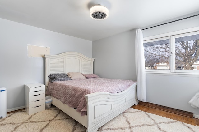 bedroom with light wood-type flooring