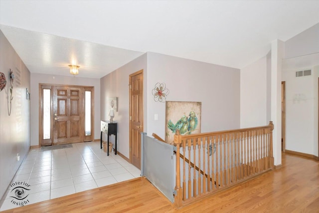 foyer entrance featuring light tile patterned floors