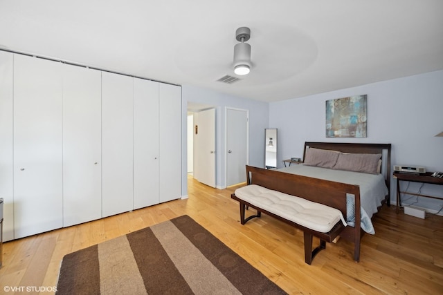 bedroom featuring ceiling fan and light hardwood / wood-style flooring