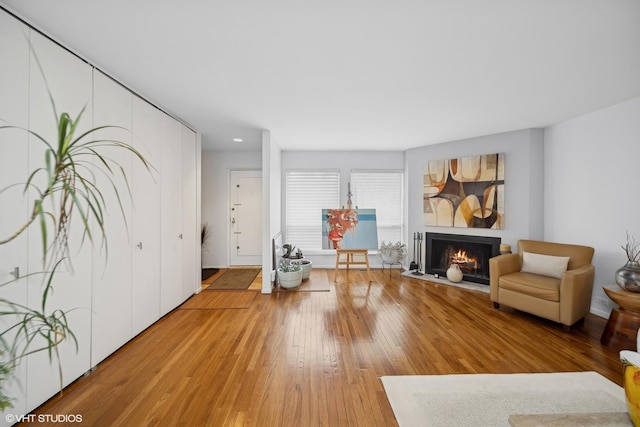 sitting room with hardwood / wood-style flooring